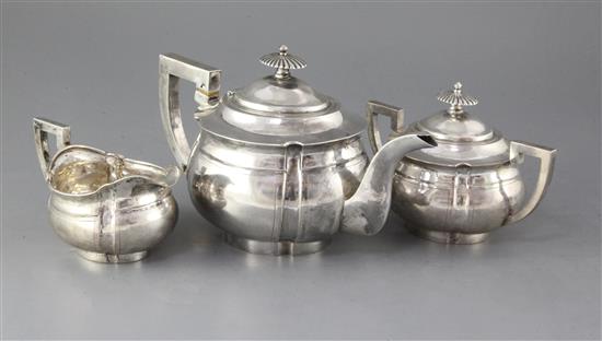A late 19th/early 20th century Chinese Export silver three piece tea set by Zee Wo, Shanghai, gross 42 oz.